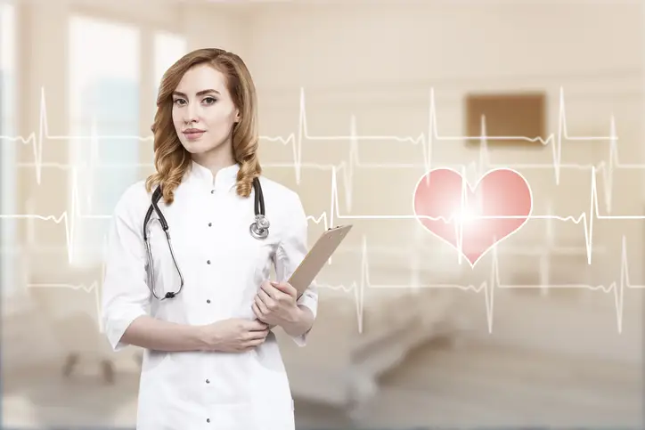 Woman doctor in a ward with cardiogram